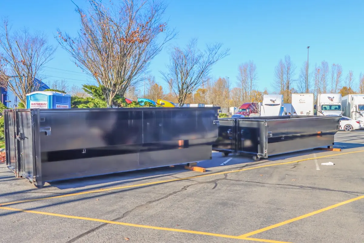 Professional dumpster rental service with roll-off container on residential driveway in Lutherville